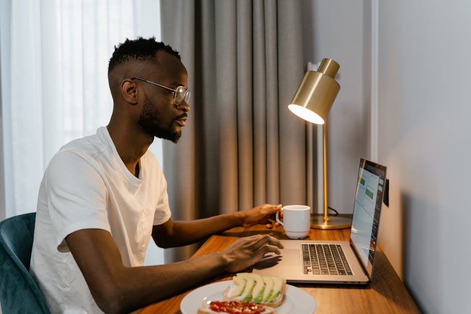 Person taking a break from computer screen looking out window